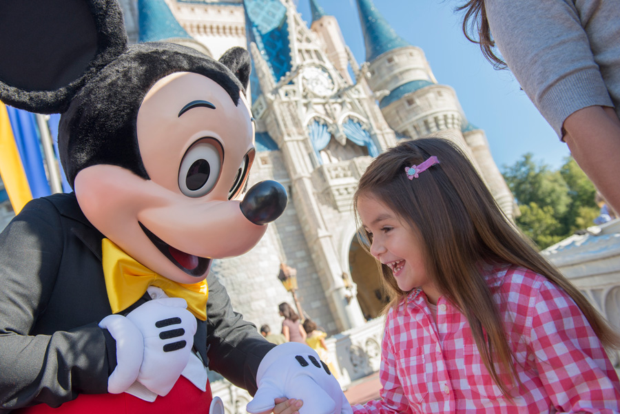 Mickey and little girl in front of Castle