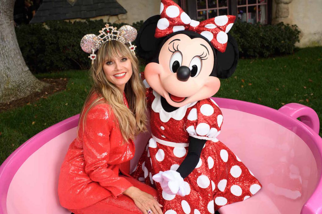 Legendary supermodel, television host and entrepreneur Heidi Klum embraces global star and fashion icon Minnie Mouse Sept. 28, 2019, at Disneyland in Anaheim, Calif., as she celebrates the launch of and dons her personally designed luxurious Minnie Mouse headband studded with 150 Swarovski crystals. Klum’s limited release design for the Disney Parks Designer Collection is available at Disneyland Resort in California, Walt Disney World Resort in Florida and on ShopDisney.com.