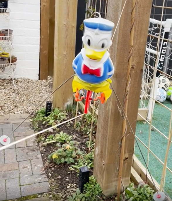 Donald Duck Fun Cycle Hi-Wire Act toy in action