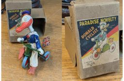 A 1930s Japanese Paradise Novelty Donald Duck cyclist banner